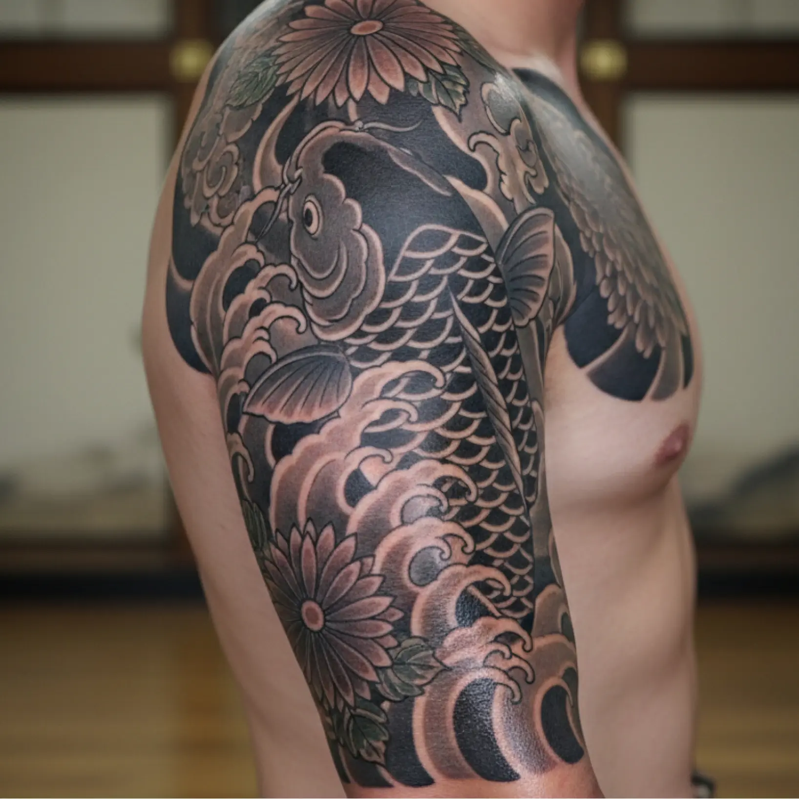 Photo to tattoo converter showing AI-generated tattoo design previewed on shoulder Photo to tattoo converter showing AI-generated tattoo design previewed on shoulder