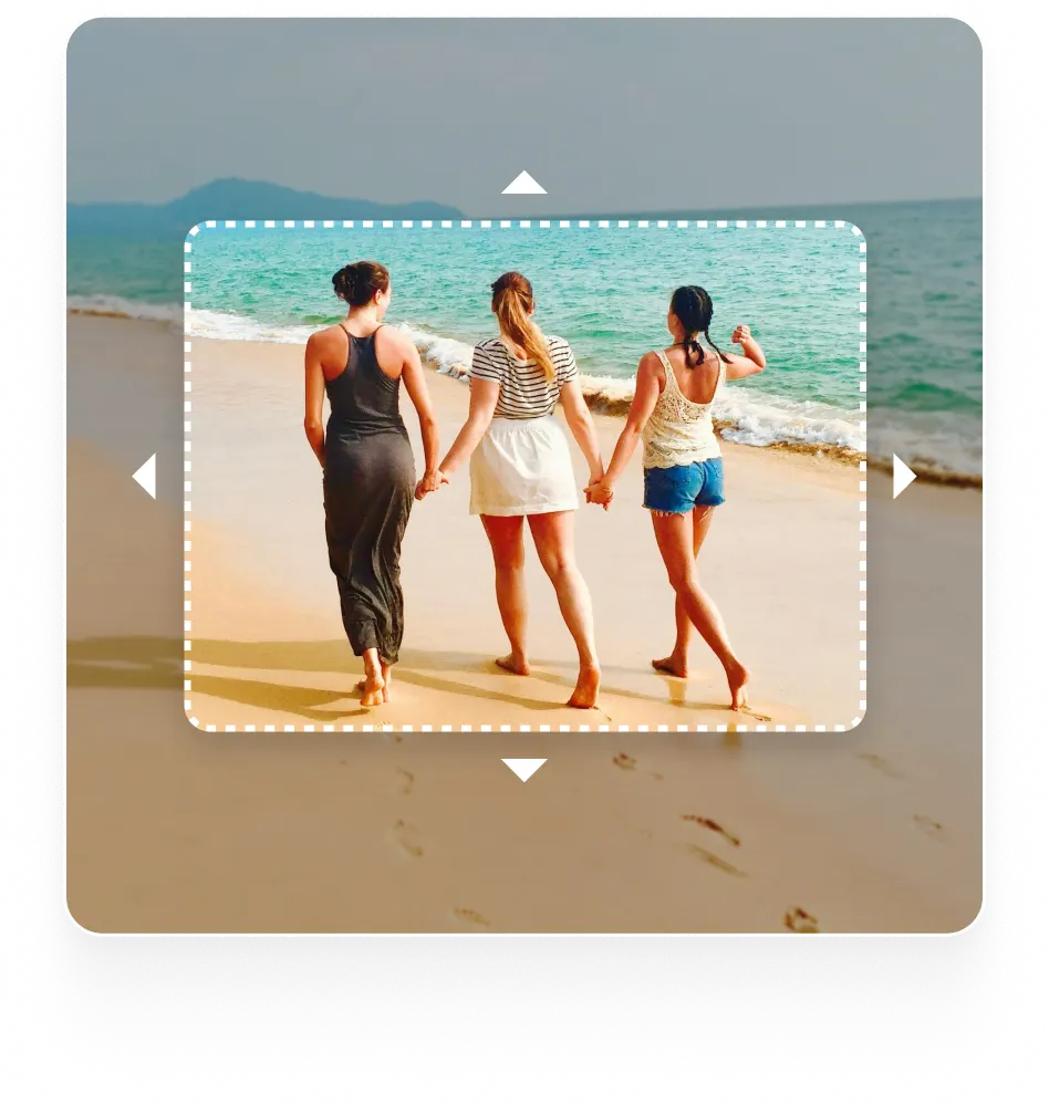 An image of three women holding hands and walking on a beach. A dotted frame with arrows suggests the use of a tool for editing or extending the image