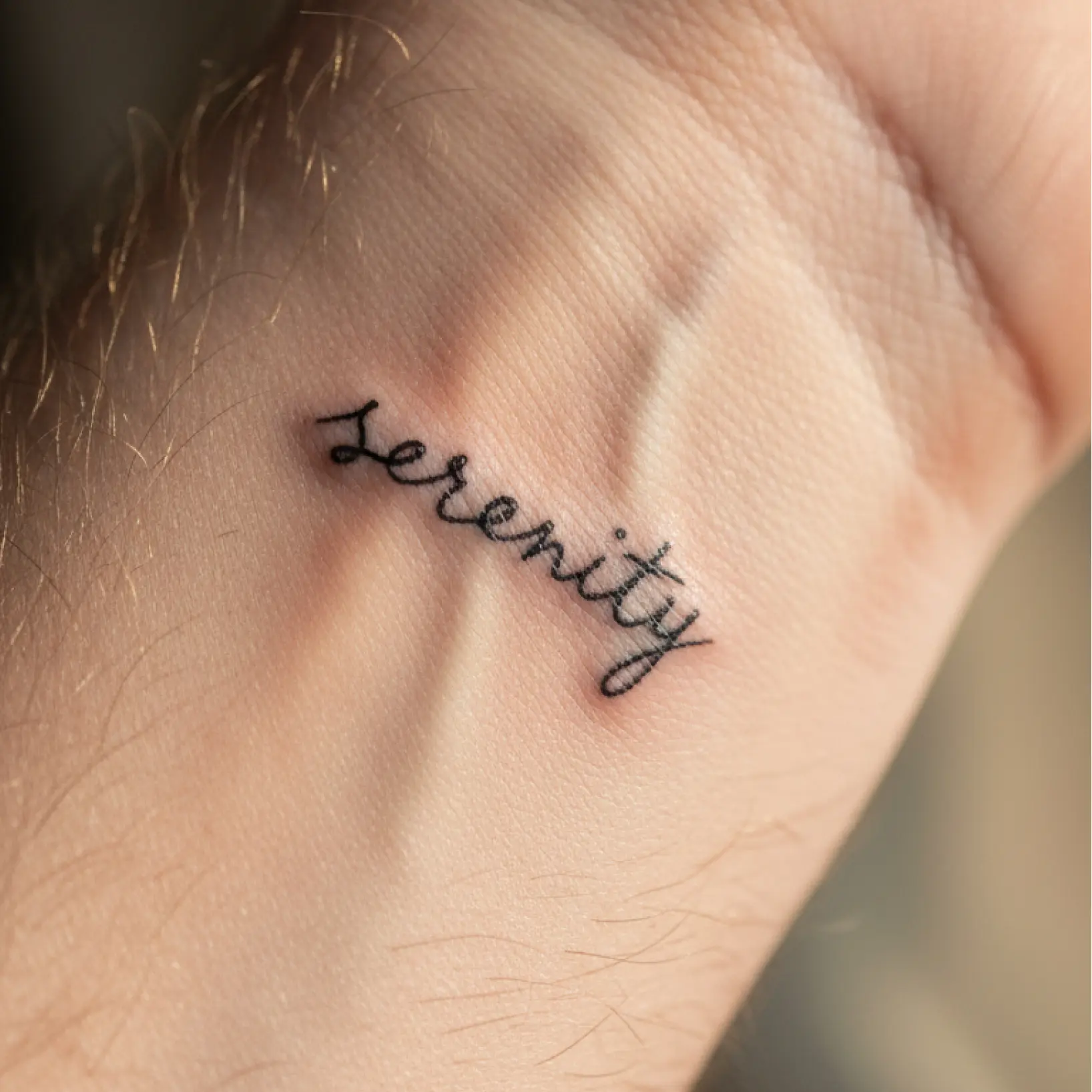 Tattoo text generator showing custom script design previewed on wrist