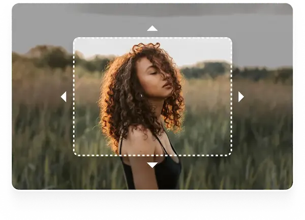 Woman in a field with a dotted frame An image of a woman standing in a grassy field with a dotted frame around her, suggesting an image extension or cropping tool