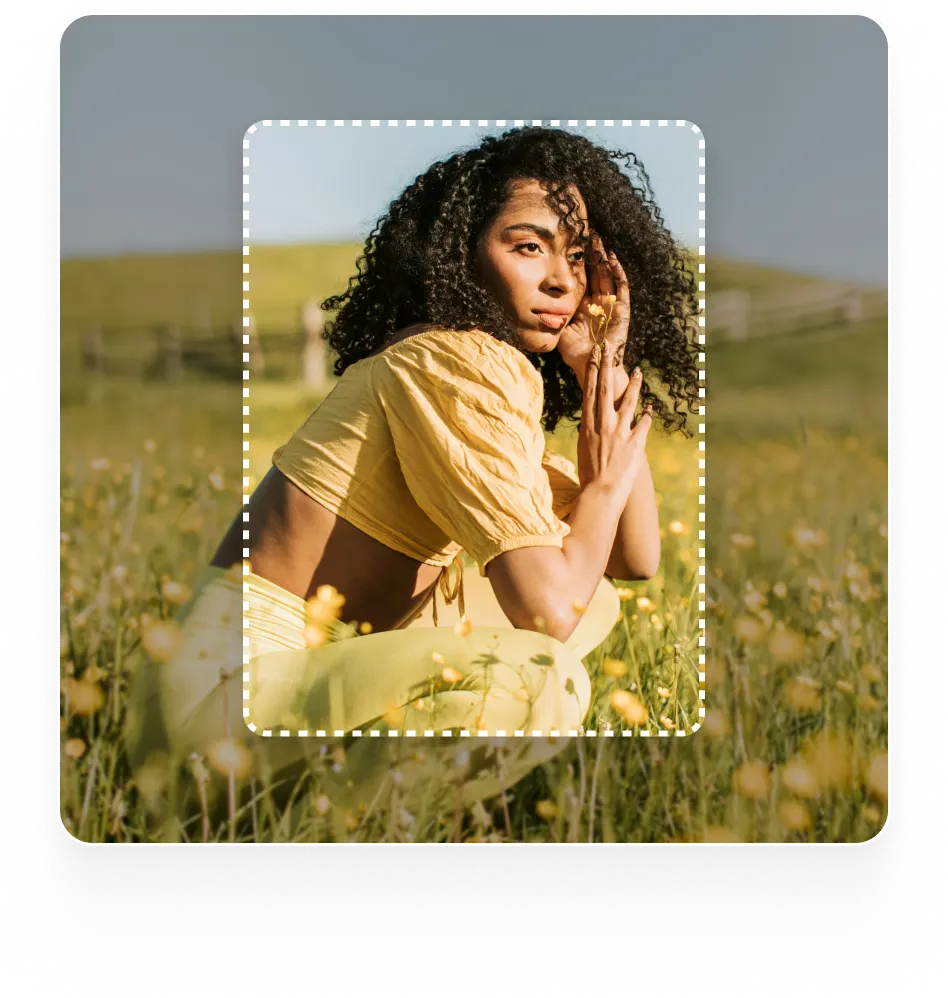 An image of a woman crouching in a field of yellow flowers with a dotted frame around her, suggesting a tool for extending or editing images
