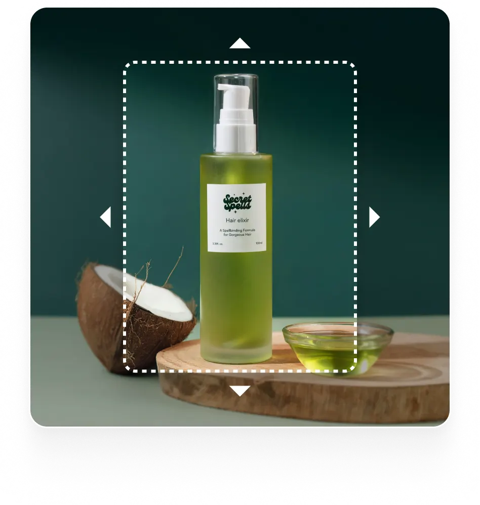 An image of a cosmetic bottle and a coconut, with a dotted frame suggesting a tool for extending or editing the image.